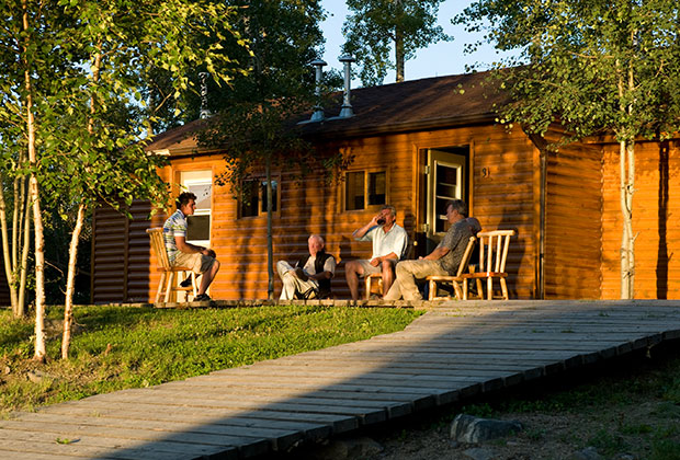 Relaxing outside their private cabin